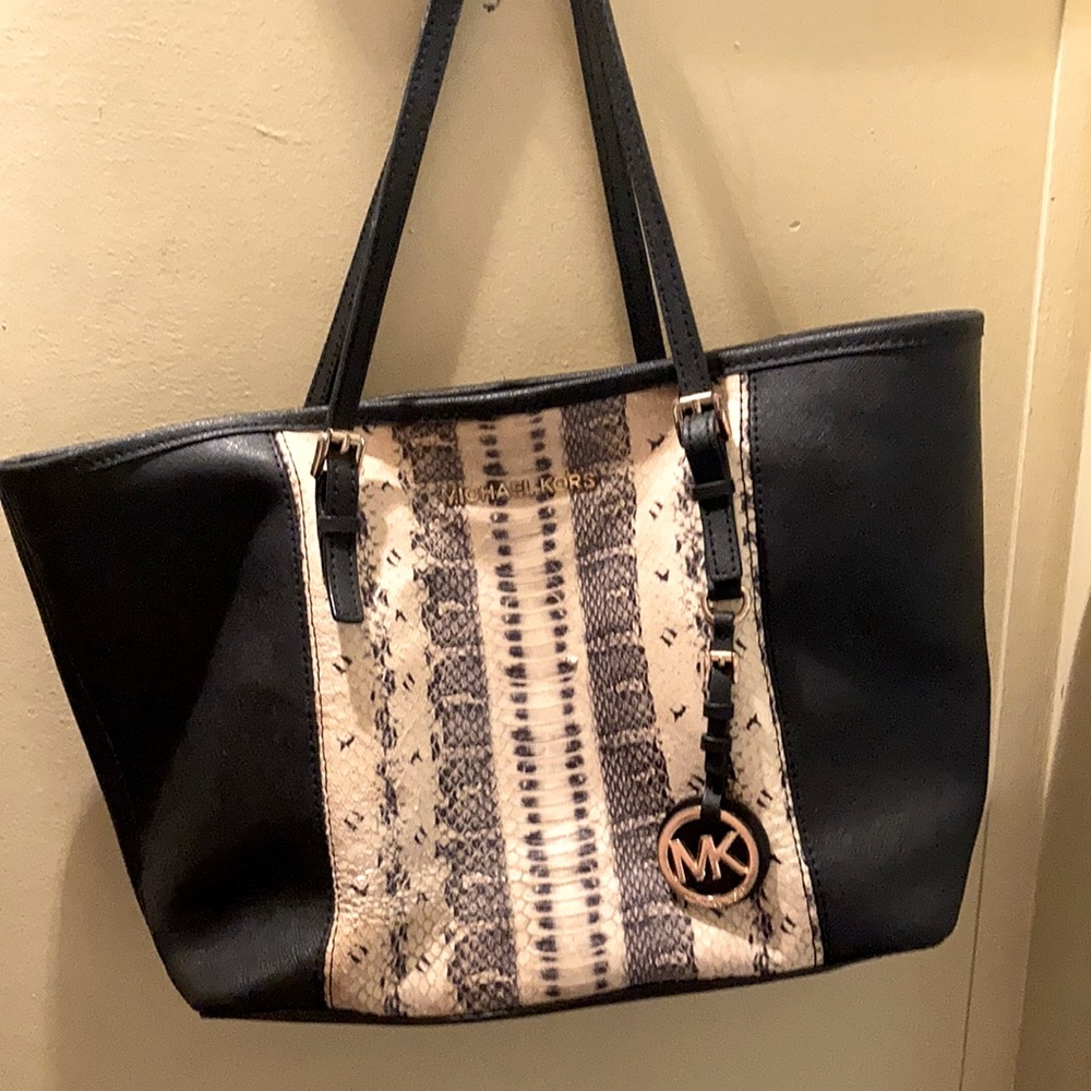 Black and snake skin Michael kors purse.